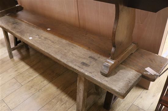 An oak bench stool, W.198cm
